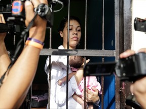 Heather Mack, 19, of the United States holds her baby daughter in jail after her verdict hearing on April 21, 2015 in Denpasar, Bali, Indonesia.