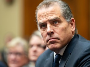 Hunter Biden, son of U.S. President Joe Biden, flanked by Kevin Morris, left, and Abbe Lowell, right, attend a House Oversight Committee meeting on Jan. 10, 2024 in Washington, D.C.