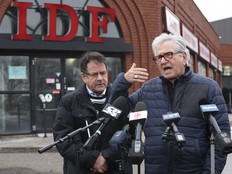Deputy Toronto mayor Mike Colle (R) and councillor James Pasternak stand outside of International Deli Foods