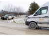 An Ontario Provincial Police cruiser and forensic investigations truck are parked at 4022 Wardell Dr. in North Middlesex on Friday, Jan. 12, 2024. (Derek Ruttan/London Free Press)