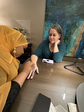 Sara Shantz takes part in a henna demonstration with artist Ayan Bashir. IAN SHANTZ/TORONTO SUN