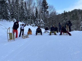 The luge crew poses during the 7.5-km trek down the mountain. IAN SHANTZ/TORONTO SUN