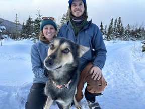 Partners Roxana Lazzaroni and Antoine Forest-Côté with one of their sled dogs, Quimek, at Bosco Charlevoix. IAN SHANTZ/TORONTO SUN