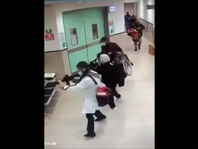 This grab taken from UGC video released on social media on Jan. 30, 2024 shows CCTV footage displayed on a computer screen reportedly of a deadly raid by undercover Israeli troops at the Ibn Sina hospital in the city of Jenin in the occupied West Bank.