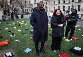 British actor Idris Elba (left) walks among clothing representing the human cost of U.K. Knife Crime displayed in Parliament square, central London, on Jan. 8, 2024, as he launches a campaign against knife crime to call the government to take immediate action to prevent serious youth violence.