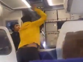 A passenger on a delayed flight attacked a pilot in India in this image taken from video on social media this week.