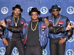 In this March 2, 1988 file photo the rap group Run DMC poses at the 31st annual Grammy Awards in New York City. From left, Joseph "Run" Simmons, Darryl "DMC" McDaniels, and the late Jason Mizell "Jam Master Jay."