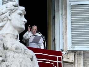 Pope Francis delivers his blessing during the Angelus prayer in St. Peter's Square at the Vatican on Jan. 6, 2024.