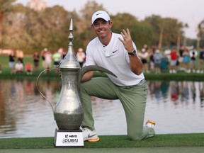 Rory McIlroy of Northern Ireland poses with the trophy, signalling his fourth victory after the final round of the Hero Dubai Desert Classic at Emirates Golf Club on Jan. 21, 2024 in Dubai, United Arab Emirates.