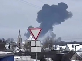 In this photo taken from validated UGC video, smoke rises from the scene of a warplane crash at a residential area near Yablonovo, Belgorod region, Russia,, Wednesday, Jan. 24, 2024.
