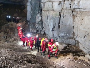 Rescuers work to rescue five people