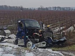 A section of Niagara-bound QEW closed after a collision that left a tanker truck in a ditch in Beamsville on Friday, Jan. 12, 2024.