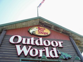 In this Sept. 19, 2017 file photo, the Bass Pro Shops logo is seen at the entrance to a store in Council Bluffs, Iowa. Police in Alabama say a man crashed his car outside a Bass Pro Shop, Thursday night, Jan. 4, 2024, and stripped down to his birthday suit and then plunged into the giant aquarium inside the store.