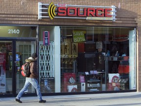 A man walks past The Source store in Toronto on Monday, March 2, 2009.