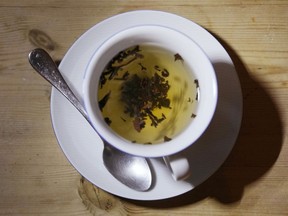 A cup of black tea with a spoon and tea leaves in London, on Aug. 29, 2022.