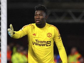 FILE - Manchester United's goalkeeper Andre Onana during the English Premier League soccer match between Nottingham Forest and Manchester United at City ground in Nottingham, England, Dec. 30, 2023. After a grueling effort to make the Africa Cup of Nations on time, Manchester United goalkeeper Andre Onana failed to make the Cameroon squad for the five-time champion's opening game. Onana was omitted from coach Rigobert Song's squad for the match against Guinea on Monday Jan. 15, 2024, despite the player's rush from England to reach the Charles Konan Banny Stadium in Yamoussoukro on time.