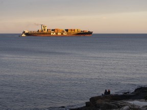 Canadian shippers are starting to feel the strain of attacks on cargo vessels in the Red Sea, as boats reach the Port of Halifax more than a week late and container rates soar. People watch as a vessel from the global shipping container company MSC departs Halifax Harbour in Halifax on Tuesday, December 26, 2023.