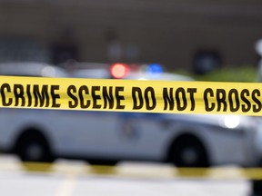 Yellow crime tape blocks off an area in Baltimore, Md., July 13, 2021.