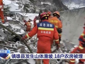 rescue workers search through rubble