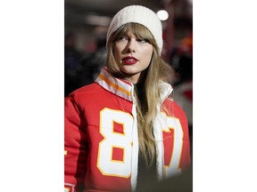 Taylor Swift wears a Kansas City Chiefs tight end Travis Kelce jacket as she arrives before an NFL wild-card playoff football game between the Chiefs and the Miami Dolphins Saturday, Jan. 13, 2024, in Kansas City, Mo.