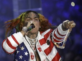 FILE - Rapper Daniel Hernandez, known as Tekashi 6ix9ine, performs during the Philipp Plein women's 2019 Spring-Summer collection at Fashion Week in Milan, Italy, Sept. 21, 2018. Authorities in the Dominican Republic have arrested the rapper, who is scheduled to appear in court on Jan. 18, 2024 on charges of domestic violence, and is being held at a jail in the capital, Santo Domingo, where he was arrested Jan. 17, according to officials.