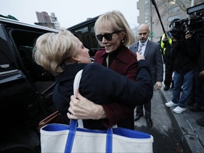Attorney Roberta Kaplan embraces E. Jean Carroll (right) as they leave Manhattan Federal Court on Jan. 18, 2024 in New York City.