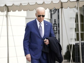 President Joe Biden walks to speak to the media before boarding Marine One on the South Lawn of the White House, Thursday, Jan. 18, 2024, in Washington. Biden is traveling to North Carolina to highlight $82 million in new investments that would connect 16,000 households and businesses to high-speed internet.