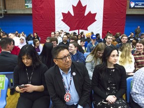 First Nations leaders are holding an emergency meeting in Ottawa today to discuss a mental-health crisis they warn could get even worse without government help. Nishnawbe Aski Nation Grand Chief Alvin Fiddler, centre, looks on during a town hall question-and-answer event with Prime Minister Justin Trudeau, not seen, in Thunder Bay, Ont., Friday, March 22, 2019.