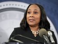 FILE - Fulton County District Attorney Fani Willis speaks in the Fulton County Government Center during a news conference, Aug. 14, 2023, in Atlanta. On Monday, Jan. 22, 2024, a judge ordered court records to be made public in the divorce involving a special prosecutor hired in the election case against Donald Trump and others, and who is accused of having an affair with Willis. The judge put off a final decision on whether Willis will have to sit for questioning in the divorce case, but delayed her deposition that had been scheduled for Tuesday.