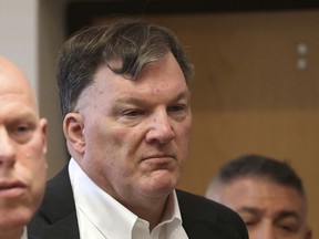 FILE - Rex Heuermann appears with his lawyer Michael J. Brown, left, at Suffolk County Court, Sept. 27, 2023, in Riverhead, N.Y. Long Island prosecutors say they are planning a major announcement in Gilgo Beach serial killing suspect Heuermann's case on Tuesday, Jan. 16, 2024, months after he was charged with murdering three women and was named as the prime suspect in the death of a fourth woman.