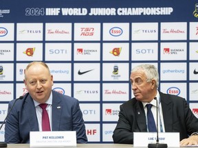 IIHF president Luc Tardif, right and Pat Kelleher, executive director USA Hockey, address the media at the IIHF World Junior Hockey Championship in Gothenburg, Sweden, Friday, Jan. 5, 2024.