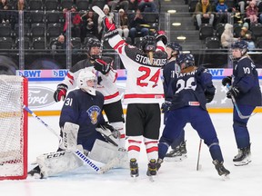 Canada's Abby Stonehouse celebrates with teammate Sienna D'Allessandro