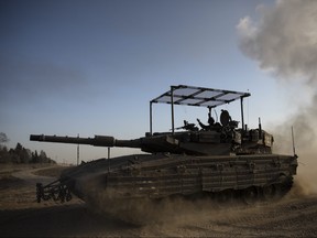 An Israeli tank moves along the border with Gaza Strip on Jan. 21, 2024 in Southern Israel, Israel.