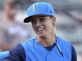 FILE - Tampa Tarpons manager Rachel Balkovec watches from the dugout, while making her debut as a minor league manager of the Tarpons, a Class A affiliate of the New York Yankees, April 8, 2022, in Lakeland, Fla. The Miami Marlins are in agreement with Yankees minor league manager Rachel Balkovec to become their director of player development, according to a person familiar with the deal. The person confirmed an MLB.com report of Balkovec's hiring to The Associated Press on Tuesday, Jan. 8, 2024, on condition of anonymity because the team had not announced the deal.