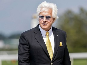 FILE - Trainer Bob Baffert walks off the track after his horse Arabian Lion won The Woody Stephens ahead of the Belmont Stakes horse race, June 10, 2023, at Belmont Park in Elmont, N.Y. Baffert said on social media Monday, Jan. 22, 2024, that he has asked attorneys to end his appeal of Medina Spirit's disqualification as 2021 Kentucky Derby winner after the now-deceased colt failed a post-race drug test that detected the steroid betamethasone in his system