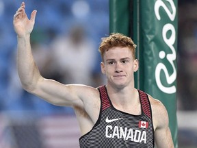 Shawn Barber waves to the crowd