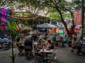 The outdoor seating area of a bar on Provenza street in Medellin, Colombia.
