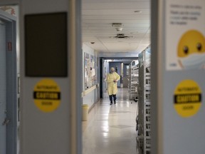 A health-care worker is seen at Toronto's Hospital for Sick Children, on Wednesday, Nov. 30, 2022.