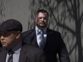 A former Toronto police officer who shot a teen on an empty streetcar told a coroner's inquest on Monday that having a stun gun would have "changed everything." Const. James Forcillo (right) leaves court in Toronto on Monday, May 16 , 2016.