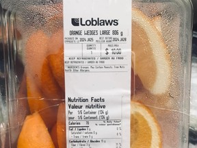 Container of cut-up orange slices priced at $10 from Loblaws.