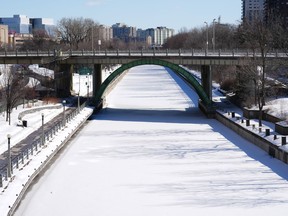 An unopened Rideau Canal is pictured in Ottawa on Friday, Feb. 24, 2023. Ottawa is looking at another weekend without skating on the Rideau Canal, even with below-normal winter temperatures on the horizon for the weekend.