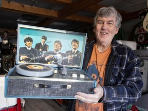 Wayne Learie of the Mad Picker in Adgergrove with a rare Beatles' record player that will be part of an auction from Jan. 30-31.