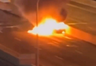 A Mercedes is engulfed in flames on the Gardiner Expressway on Jan. 18, 2024 in a screengrab from video posted to Instagram.