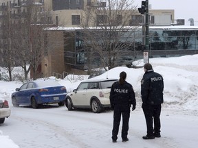 Police attend the scene of a shooting at a Quebec City mosque on Monday, Jan. 30, 2017.