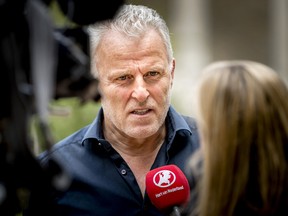 Dutch crime reporter Peter R. de Vries speaks with media