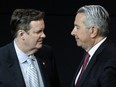 Edward Rogers, left, talks with Tony Staffieri at the Rogers Communications annual general meeting in Toronto on Wednesday, April 26, 2023. Two members of the Rogers family who had opposed their brother Edward's plan to replace former chief executive Joe Natale with his successor Staffieri have announced their retirement from the company's board of directors.THE CANADIAN PRESS/Chris Young