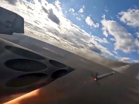 In this photo taken from a video released by the Russian Defecse Ministry Press Service on Saturday, Jan. 6, 2024, Su-25 ground attack jets fire rockets during a Russian air force mission in Ukraine.