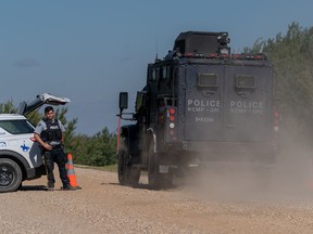A Tactical Armoured RCMP Vehicle drives past a police road block set up in James Smith Cree Nation, Sask., on Tuesday, September 6, 2022.
