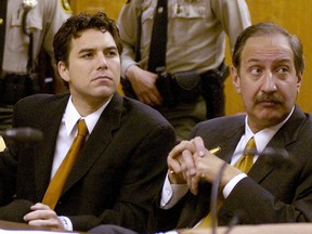Scott Peterson, left, sits with his attorney