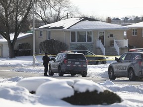 Police work at the scene of a shooting